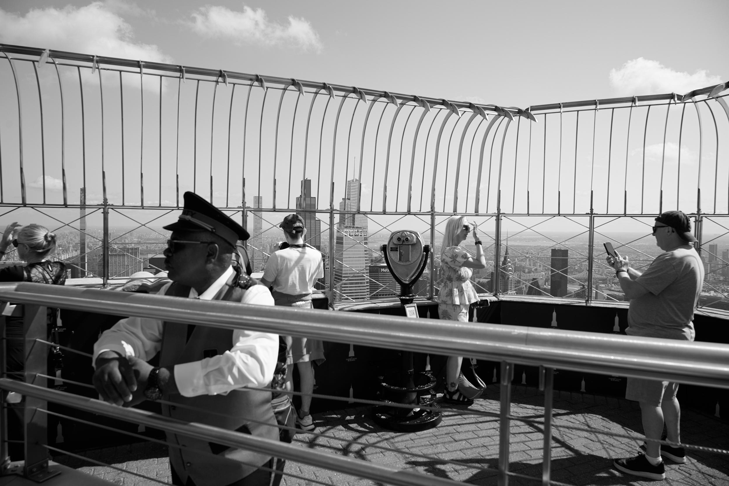 New York City - Visitors take in the view from the Empire State Building’s observation deck.