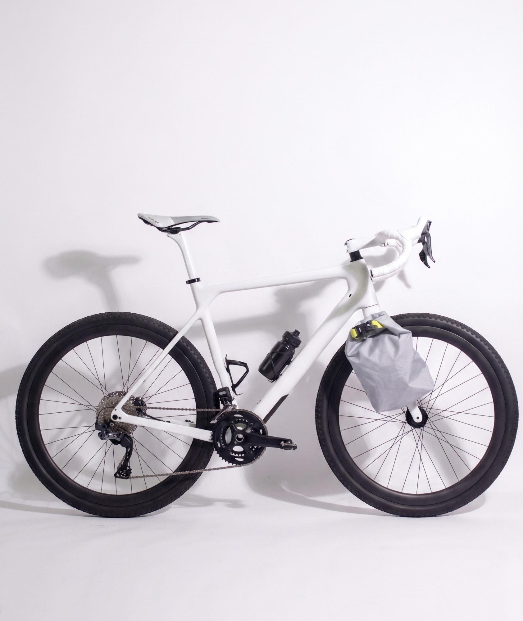 North are bike packing bags built around a fully PFAS free material palette and high performance recycled fabrics to genuinely lower the environmental impact. Focusing on the everyday needs and issues of the modern bike packer, this product sets itself apart through an effortless connection between bag and fork. Designed to work in the toughest conditions and operate easily even when your hands are cold and wet!